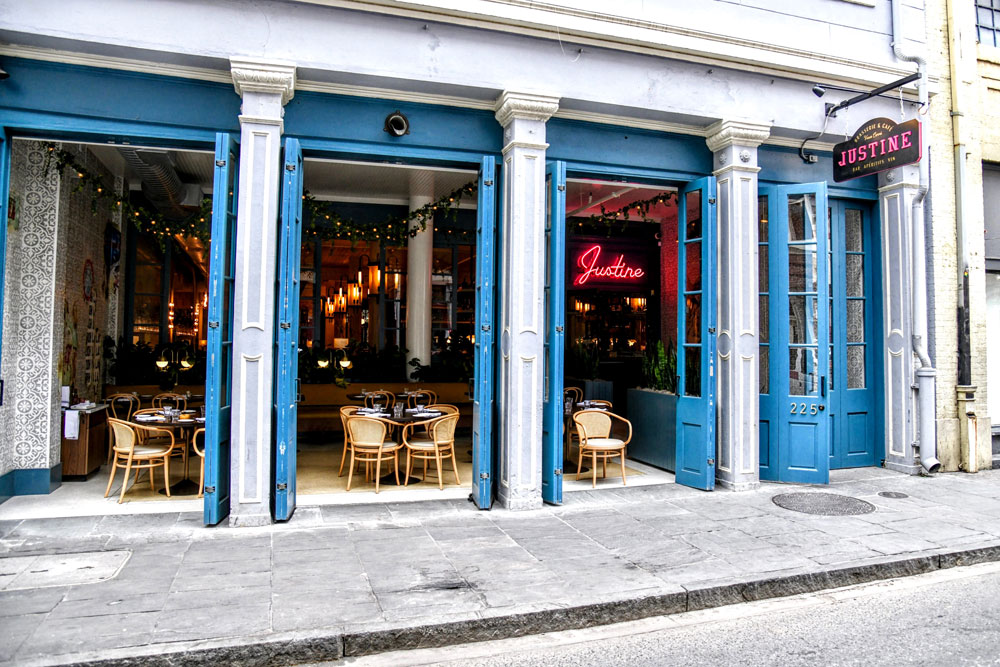 A cafe with a blue and white exterior facade
