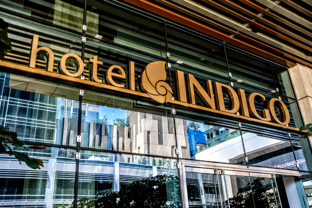 Hotel Indigo logo at the building entrance